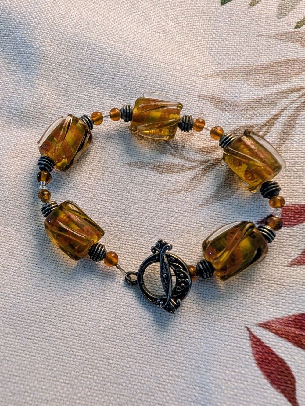 Hand Crafted Amber-Tone Glass Bead Bracelet with Silver Toggle